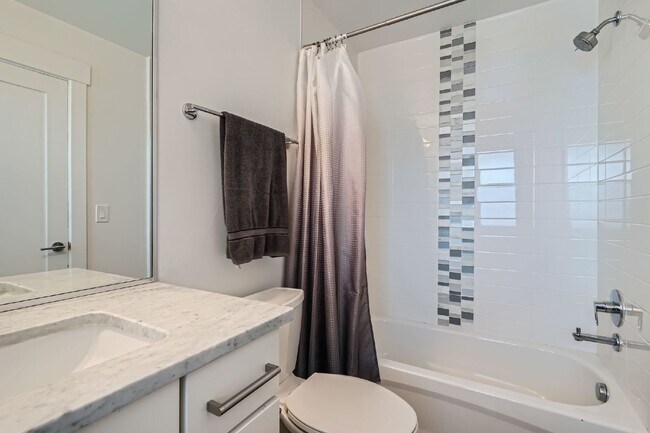 Building Photo - Available NOW! SIX MONTH LEASE - Spacious 3-Bedroom Townhouse with 3.5 Baths in Vibrant Sloans Lake!
