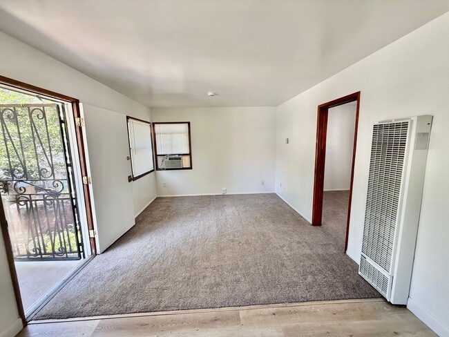 Building Photo - Charming Upstairs 1 Bedroom / 1 Bath Unit with Garage & Private Laundry