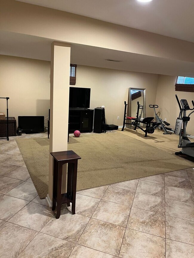 Building Photo - Updated & Landscaped 4 Bedroom, 4 Bath Hom...