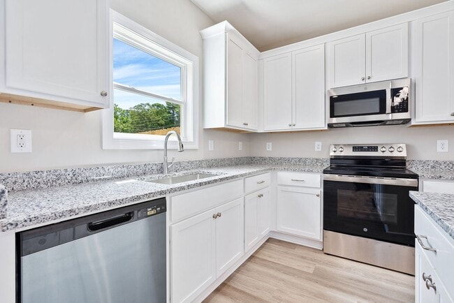 Building Photo - New Townhome in Hartbrook!