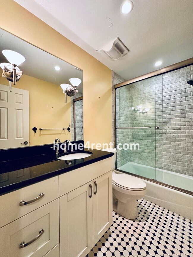 Building Photo - A Lovely Lenexa Home w/ Wood Floors Throughout, Updated Kitchen, Finished Basement and a Fenced Y...