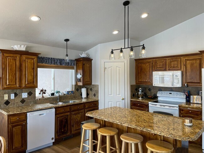 Building Photo - Beautiful home with 3 car garage and oversized covered deck.