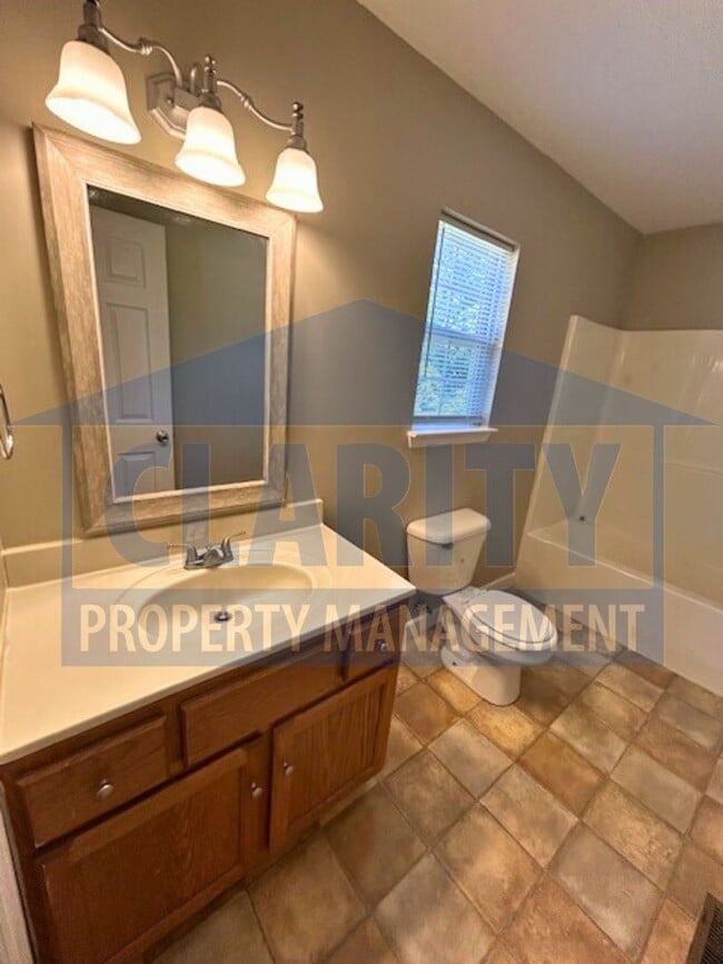 Building Photo - Charming three-bedroom home with carport!