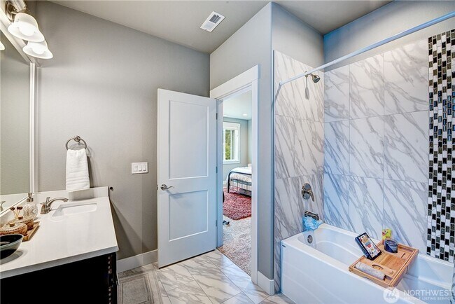 Building Photo - Luxury NW Living: 4 Bedroom Masterpiece with Dual Suites and Private Yard in Desirable Browns Point!