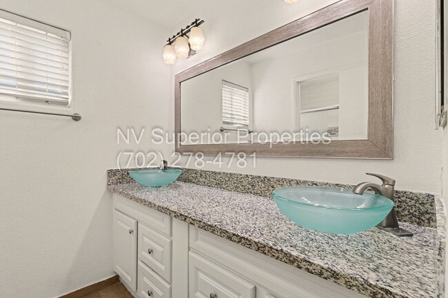 Building Photo - NW!! 4 Bedrooms!!! All Tile and Pergo flooring T/O!! NO Carpet!!! Low Maintenance Desert landscap...