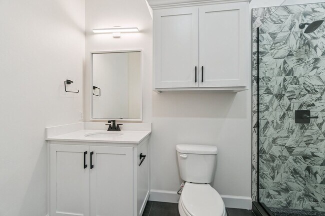 Building Photo - Bright. Clean. Calm. Your Elevated One-Bed...