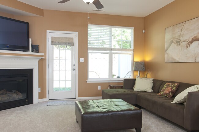 Living room with cozy fireplace - 8939 Camden Park Dr