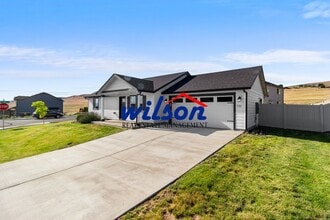 Building Photo - Welcome Home: Big Yard, Garage, and Pets A...