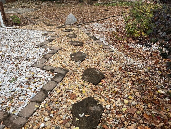 Building Photo - Charming Brick Ranch with Beautifully Landscaped Yard and Attached Carport