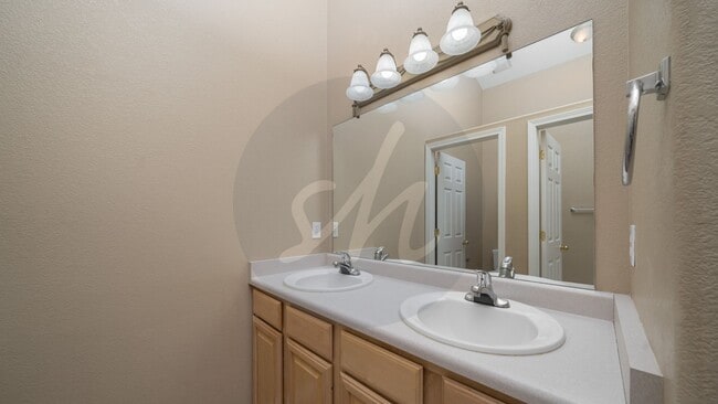 Building Photo - Spacious 3BR Townhome with 2-Car Garage & Private Covered Balcony