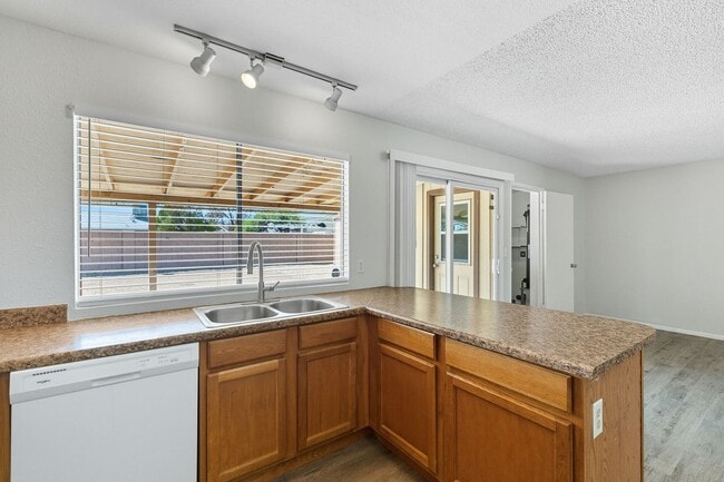 Building Photo - Three bedrooms plus big garage!