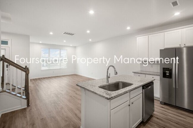 Building Photo - Spacious 3-Bed / 2.5-Bath Townhome with First-Floor Den, Hardwood Floors & 1-Car Garage – Wendell...