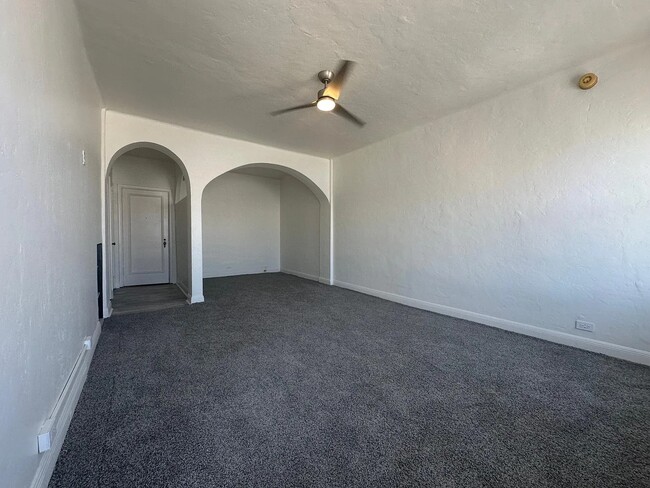 Living area with sleeping alcove big enough for King-sized bed, New bi-directional smart ceiling fan - 631 Ofarrell St