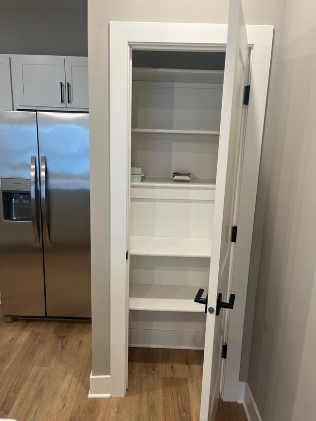 Building Photo - New Construction, 2 bed, 3 bath Row Home, with 2 car garage, fireplace, and rooftop deck!