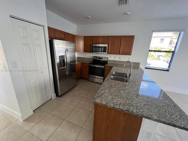 Building Photo - 9399 W 33rd Ln