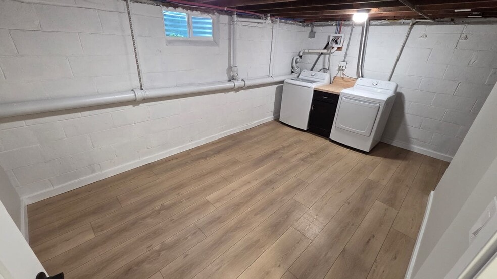 Laundry Room: 15'10" x 9'8" laundry room is equipped with a brand-new high-efficiency washer/dryer - 604 Holly Ln