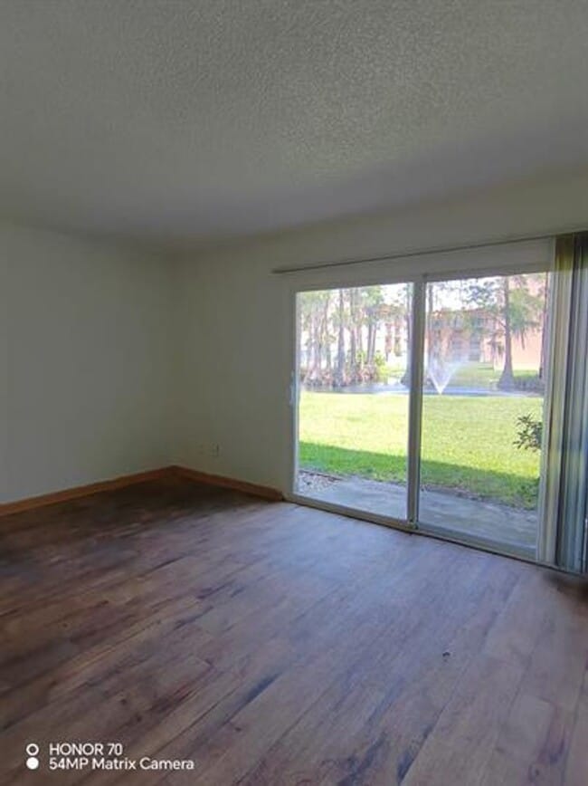 Building Photo - Welcome to Tampa Racquet Club – Where Comfort Meets Convenience!