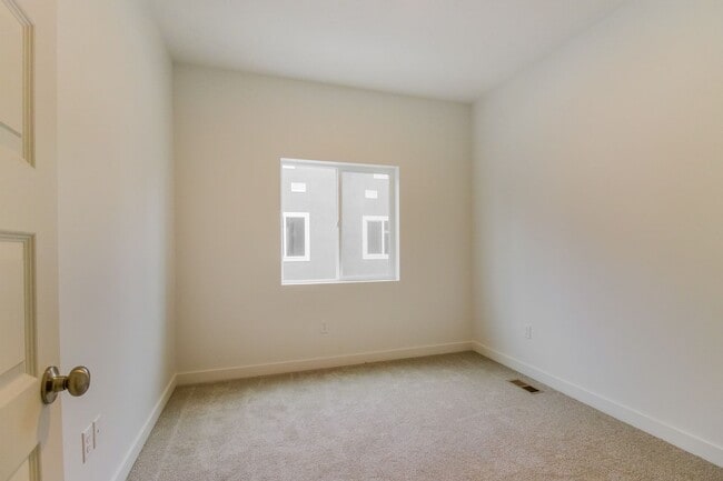 Building Photo - Amazing Modern three-story new build townhome!