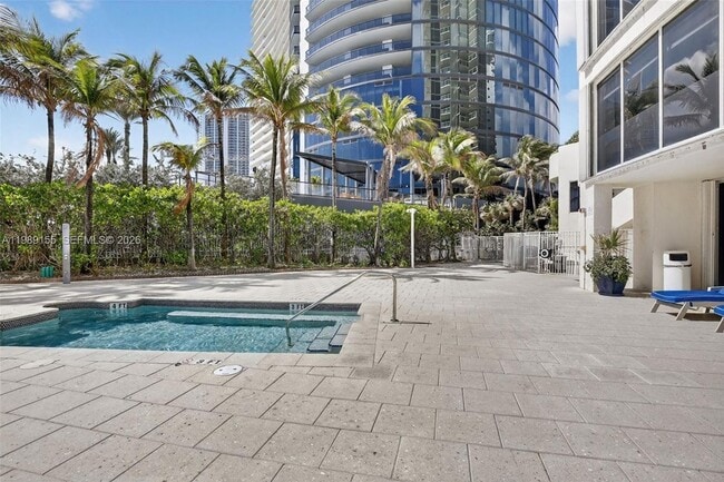 Building Photo - 18671 Collins Ave