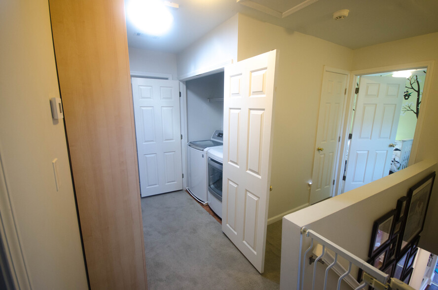 Upstairs hallway with large linen cabinet and laundry - 121 Brower Street
