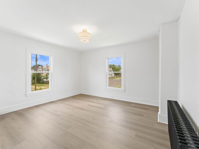 Building Photo - Renovated 3-Bedroom Apartment with Bonus Finished Attic & Spacious Shared Backyard