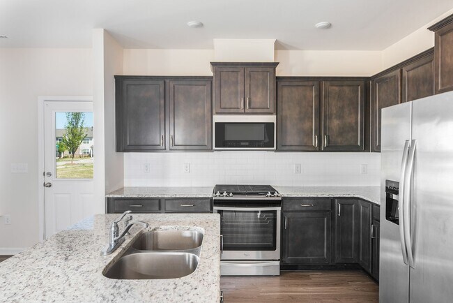 Building Photo - End unit townhome loaded with upgrades close to RTP! Available: Now