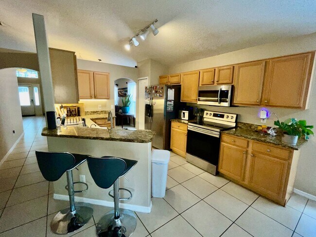 Building Photo - Modern 4-Bed, 2-Bath Solar-Powered Home Near UCF