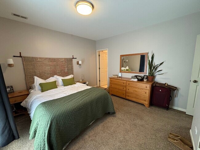Primary bedroom with ensuite bath and private deck - 1241 N Maplewood Ave