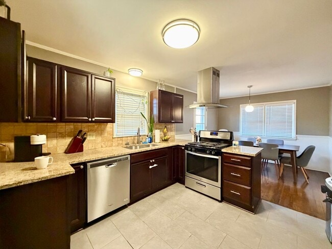 Building Photo - {7710} Prairie Village Split Level with Two Car Garage + Two Full Bathrooms + Hardwood Floors + U...