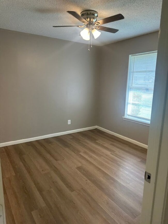 Building Photo - 4/1.5 PTISD Fenced yard and pet friendly