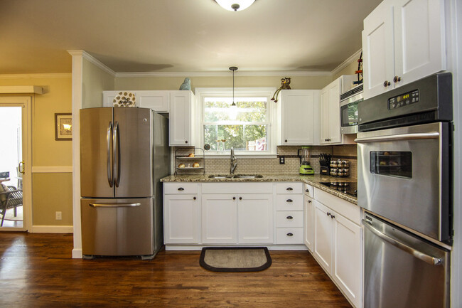 Photo 15. Kitchen with stainless Steel appliances and original hardwood floors - 1623 Lethia Dr