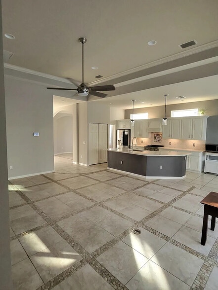 Custom renovated kitchen with a curved quartz countertop and new appliances - 4353 Reflections Pky
