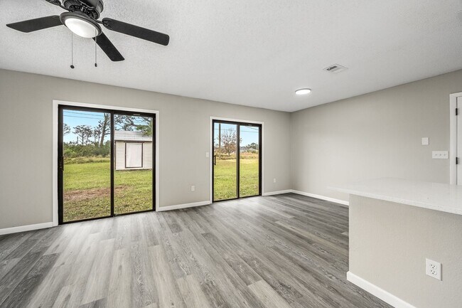 Building Photo - Charming Palm Bay Retreat - Perfect for Relaxation and Entertainment!