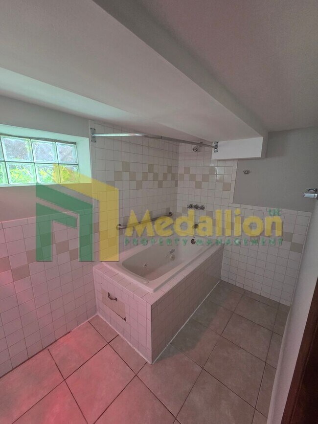 Building Photo - Spacious 6-Bedroom Home with Finished Basement and Backyard
