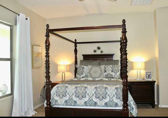 Spacious primary bedroom overlooks the backyard private pool and jacuzzi - 20892 W Eastview Way