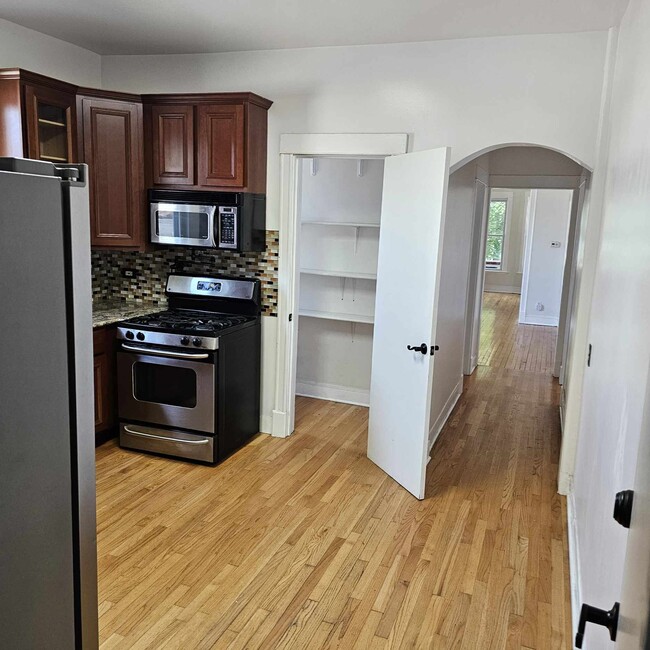 Kitchen Facing South with Walk in Pantry - 4816 W Berteau Ave