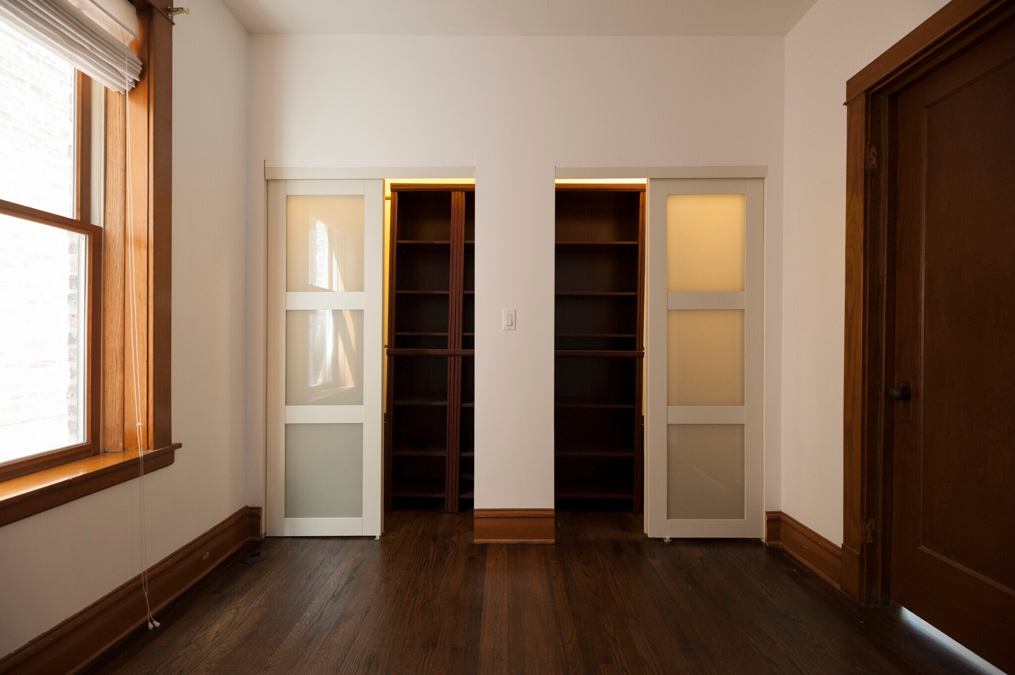 Master bedroom closet with built-in storage, facing south - 2250 W Addison St