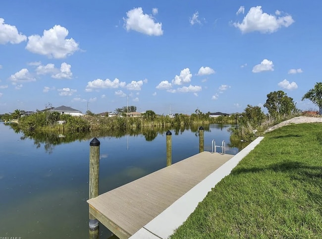 Building Photo - Almost New Construction Waterfront Home in NE Cape Featuring A Pool, Fenced Yard & More! COMING SOON