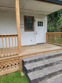 Building Photo - RENOVATED 2 BDRM, 2 BATH UPSTAIRS CONDO.  ...