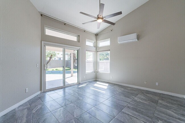Building Photo - Charming 4-Bedroom Home with Luxurious Poo...