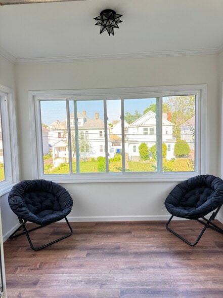 From the Living Room, open the French Doors to your refurbished 3 season porch - 135 Dover Rd