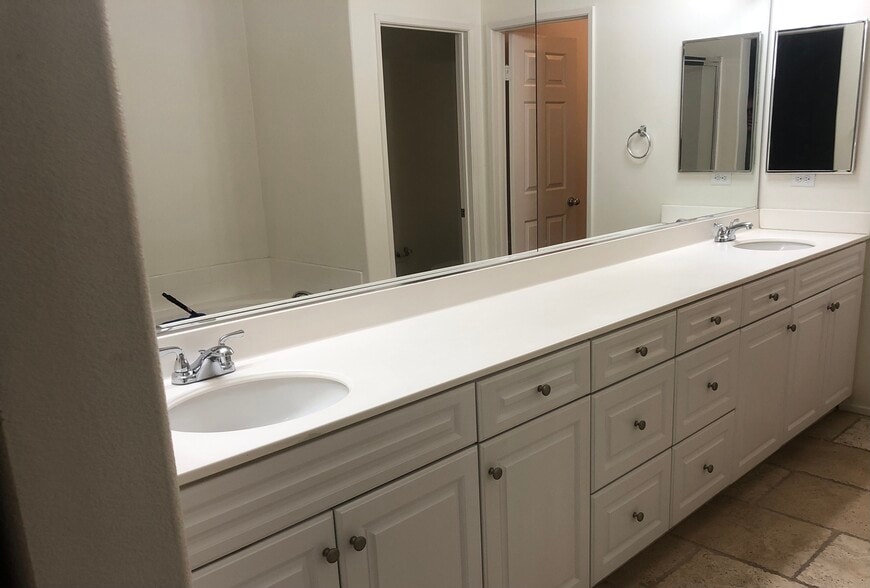 Master bedroom bath with double vanity . - 6395 Delgado Ln