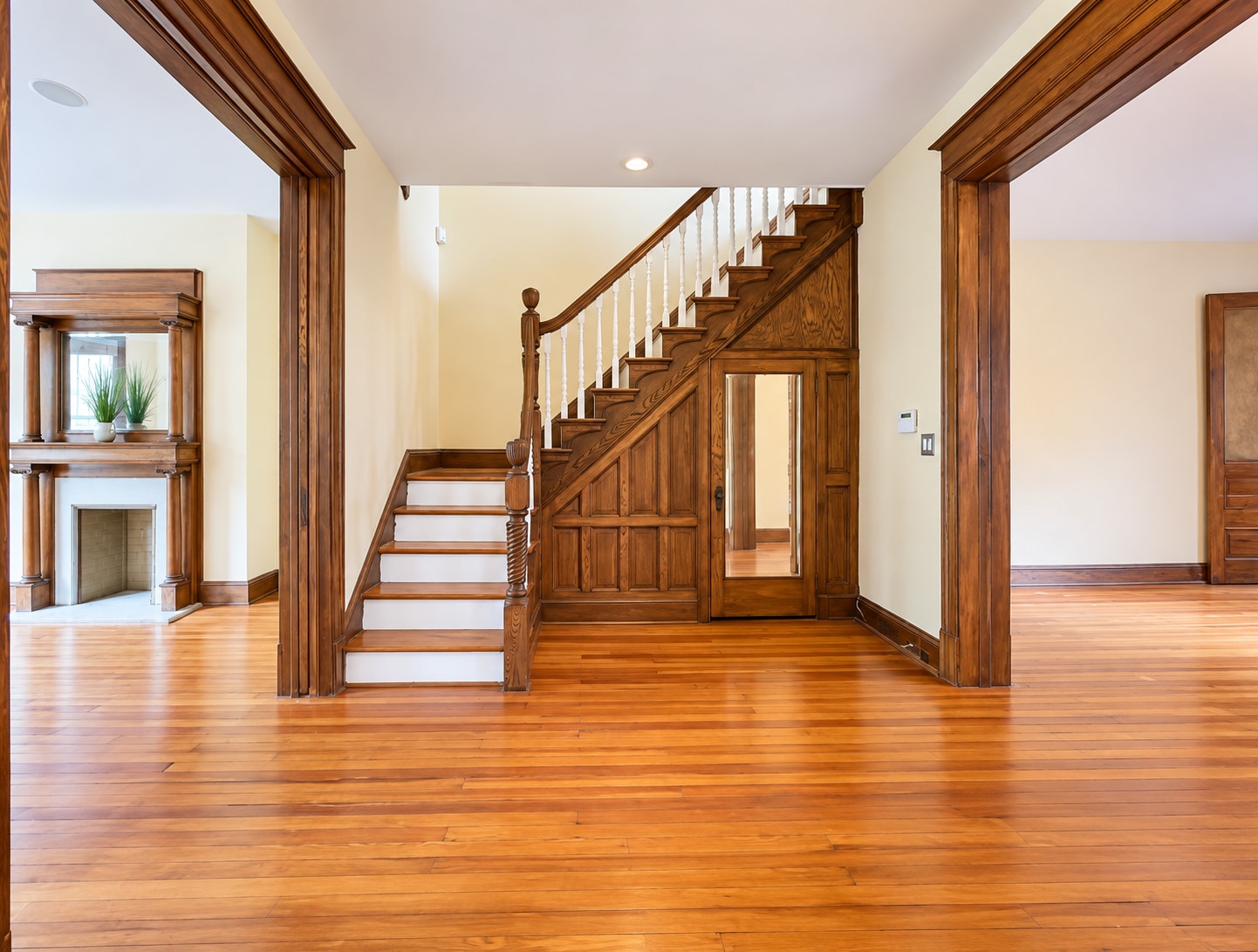 Beautiful original staircase & woodwork showcase the home's historic character. Storage under stairs - 2322 1st St NW