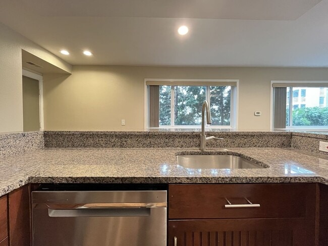 Building Photo - Ground Floor End Unit on Jantzen Beach with River Views & Flexible Living Space