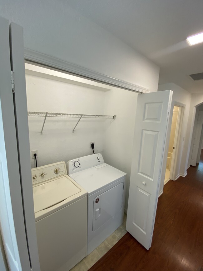 Washer dryer included on second floor with storage rack - 2451 SE 14th Ave