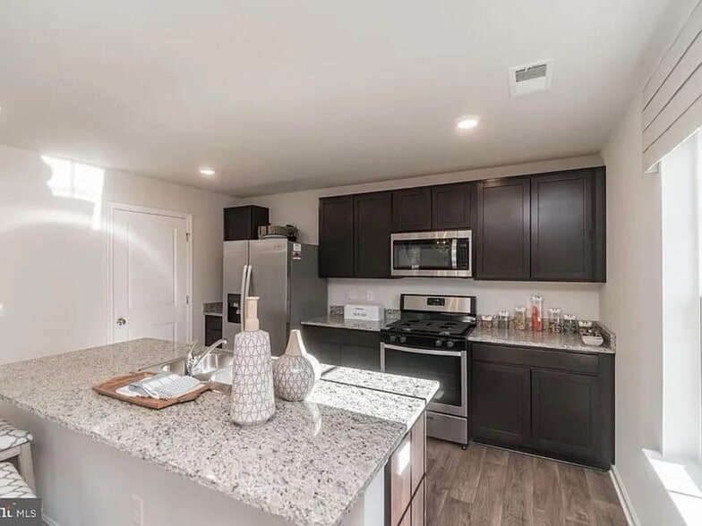 Kitchen with Island - 377 Aylesbury Ln
