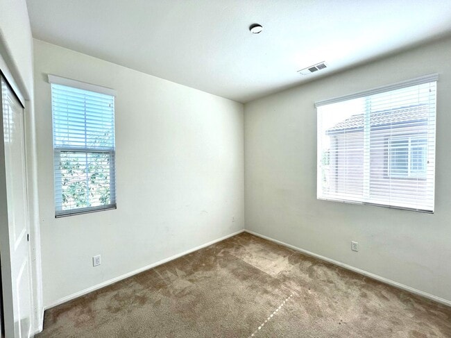 Building Photo - Beautiful 4 Bedroom Condominium with Attached Garage Located in Gated Community of Eastvale