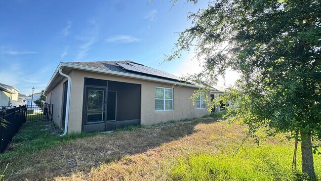 Building Photo - Available NOW! Spacious 4BD/2BA Haven in Villages at Harmony – Your Dream Home Awaits! WASHER & D...