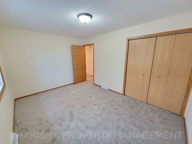 Building Photo - 4 BD, 2 BA - FENCED IN YARD, PRIVATE TRAILS, FINISHED UPPER AND LOWER LIVING AREAS, ATTACHED GARAGE!