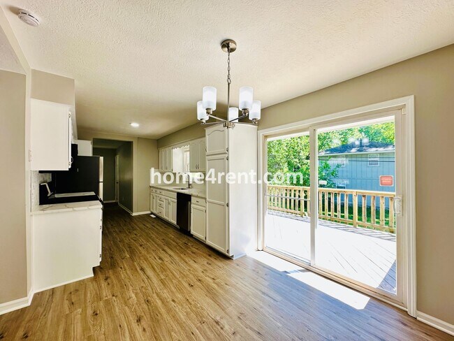 Building Photo - Like New, Ranch Style Home in Raytown - Wood Floors, Finished Basement, Fenced Yard!